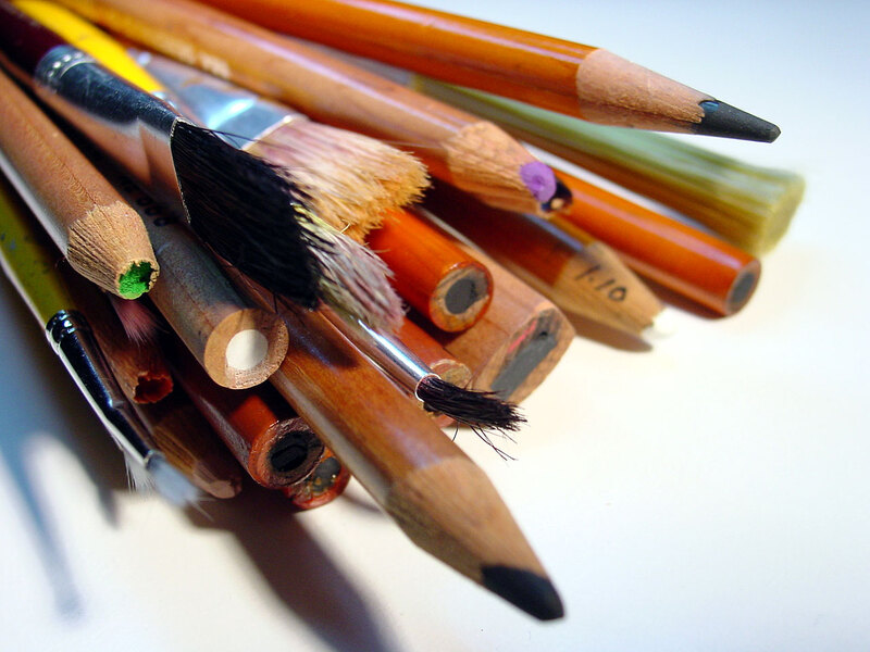 Bundle of pencils and paintbrushes.